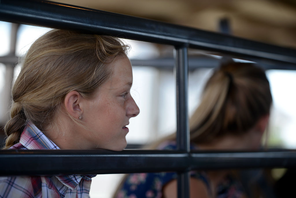 Nikki Crocker leans on a fence